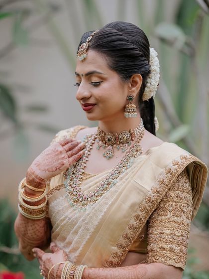 A beautiful side profile, highlighting her hairstyle and the glow on her skin.