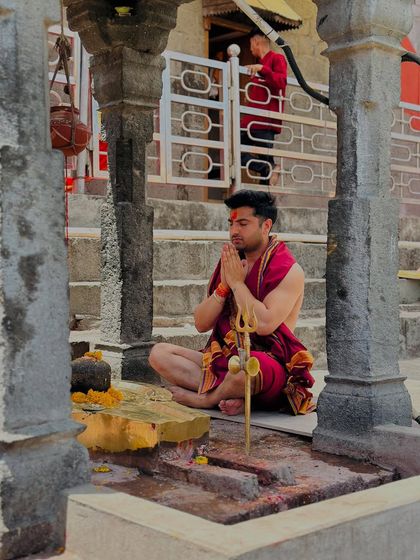 In prayer at a temple. My faith is my anchor, providing strength and clarity in both my personal and professional life.