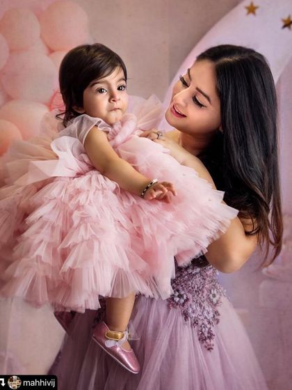 The bond between a mother and daughter is so special. This beautiful portrait of Mahhi holding Tara captures that love perfectly. I always aim to photograph these quiet, tender moments during a family session.