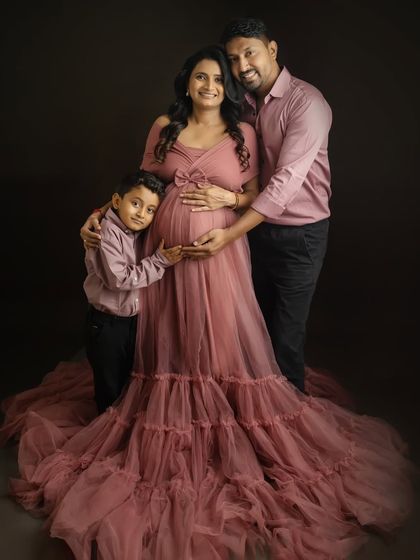 A beautiful family portrait that shows the love and connection between all of you. The flowing gown adds a touch of fairytale magic to this special moment.