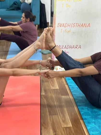The smiles say it all. Partner yoga brings a playful and supportive element to the practice, strengthening bonds within our community.