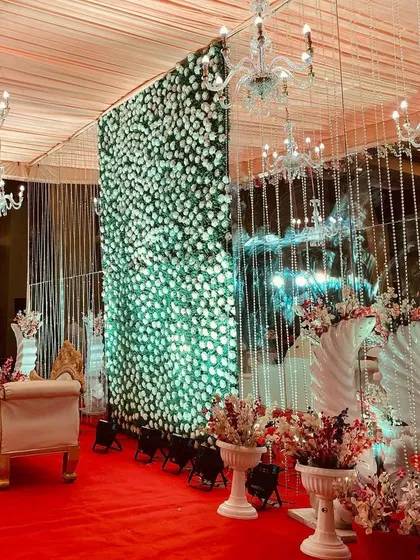 Another view of the elegant indoor stage, this time with a focus on the beautiful white floral arrangements.