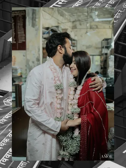 Even a simple court marriage can be a beautiful story. We focus on the joy and emotion of the moment, like this forehead kiss, proving that love's biggest celebrations don't always need a grand venue.