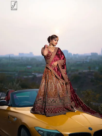 This pose highlights the flow and volume of the heavily embroidered lehenga skirt, with the velvet dupatta adding a touch of regal color.