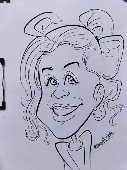 She looks so cute, yes or no? A fun caricature with a big bow in her hair.