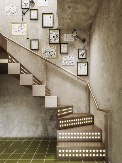 These renders showcase a unique industrial-style staircase with integrated lighting. We highlight the raw concrete walls, the metal steps, and the gallery wall of art to capture the edgy, creative design.