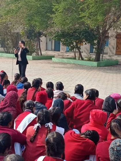 Speaking to students in the school assembly area. Addressing a large group allows me to spread awareness about basic nutrition to a wider audience.