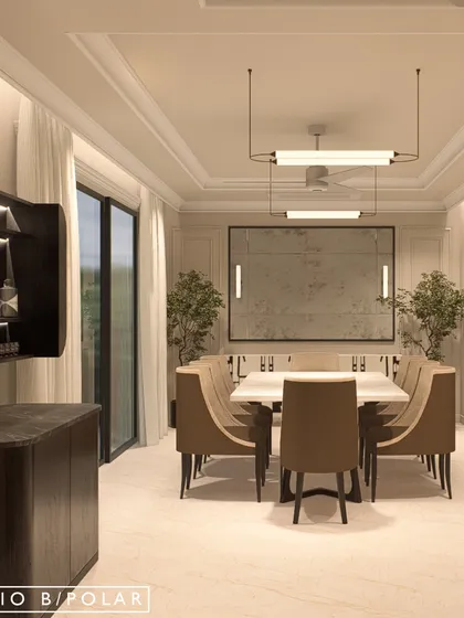 In this upcoming villa, the dining room is designed with a soothing beige palette and elegant classical molding. A floating bar cabinet adds a modern touch to the otherwise timeless space.