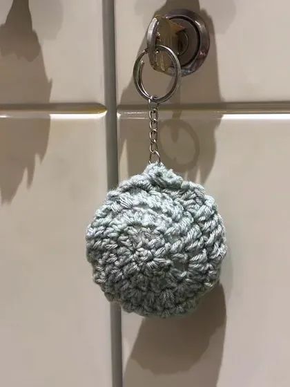 From a flat circle to a 3D ball. This student used the magic circle and single crochet stitches to create a cute little keychain. It's amazing what you can make with a few basic skills.