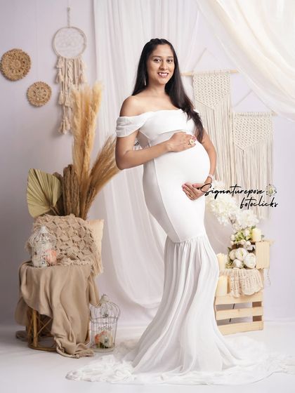 A classic full-length portrait in a white mermaid gown, set against the beautiful textures of the boho backdrop.