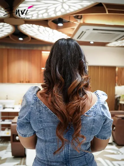 Beautifully styled curls after a fresh cut. We specialize in creating cuts that enhance natural texture and provide a stunning silhouette.
