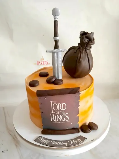 One cake to rule them all! I took a journey to Middle-earth to create this epic Lord of the Rings cake for Advay's birthday. This minimal-fondant cake features the iconic sword and other elements from the beloved series.