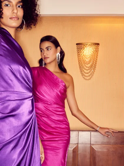 A dual-model shot for a party wear brand, showcasing two jewel-toned dresses. My direction focused on creating a sense of glamour and friendship, perfect for the brand's target audience.
