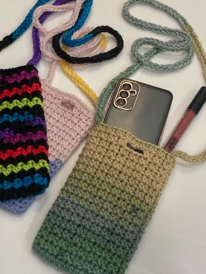 My handmade crochet phone slings are perfect for when you want to be hands-free. They fit your phone and a lipstick or card, and I make them in lots of different colors and patterns.