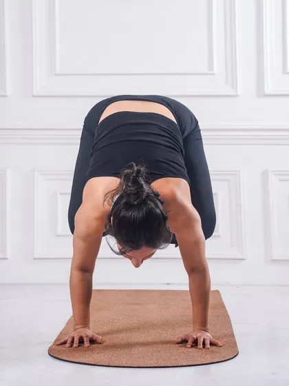 Getting into Kakasana (Crow Pose). This is often the first arm balance yogis learn, building foundational strength in the arms and core, and teaching us to trust ourselves.