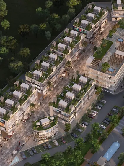 This is a top-down aerial rendering of a mixed-use commercial development. This perspective is invaluable for urban planning and traffic flow analysis, showing how pedestrian zones, retail blocks, and roadways interact within a masterplan.