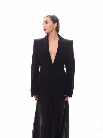 Patralekhaa looking away from the camera, giving this shot a candid, editorial feel. The focus is on the powerful silhouette of the Balenciaga blazer and her sleek hair and makeup.