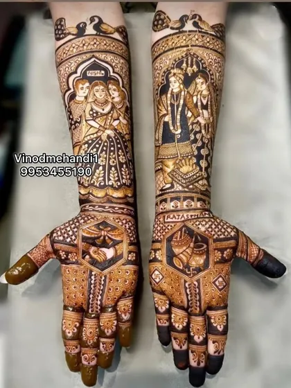 This unique bridal mehendi tells a complete family story. One arm shows the bride with her parents, while the other depicts the varmala ceremony, creating a beautiful narrative.