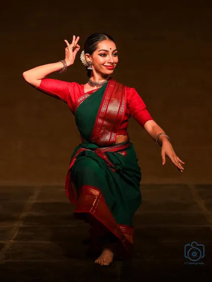 A similar pose to the previous one, showcasing the fluidity and grace of the movement.