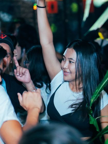 Another happy face in the crowd, pointing up in appreciation. The connection with the audience is everything.