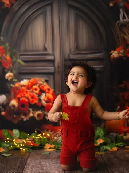 When you just want to kiss those cheeks. This little sweetheart is spreading so much joy with her sparkling eyes and precious laugh in this autumn portrait session.
