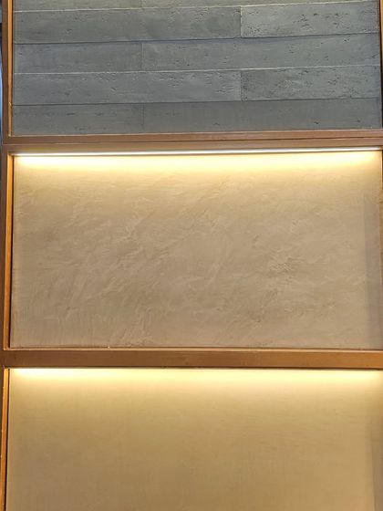 The 'Origins' series, featuring finishes that look like slate tiles and smooth micro-concrete. These offer a minimalist and sophisticated aesthetic.