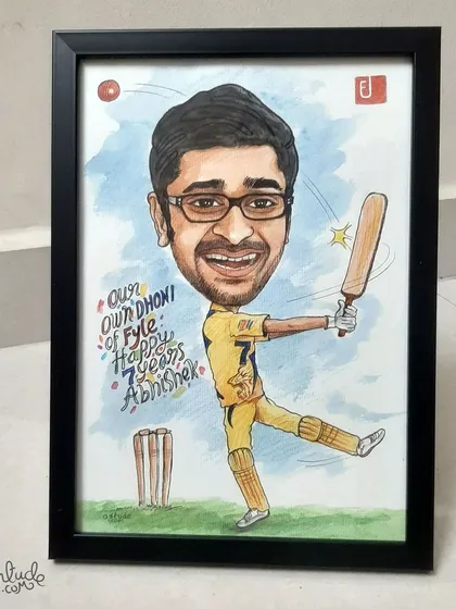 Another shot of the framed cricket-themed caricature, showing the vibrant colors and personalized message.