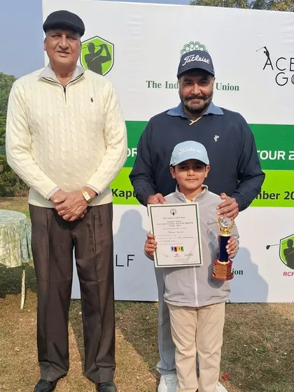 Taanush Kumar receives his trophy at the RCF Golf Course, Kapurthala.