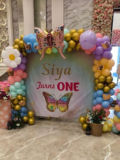 Another photo corner I created for the same event, with a custom backdrop, balloon arch, and a fairy cutout on a balloon pillar.