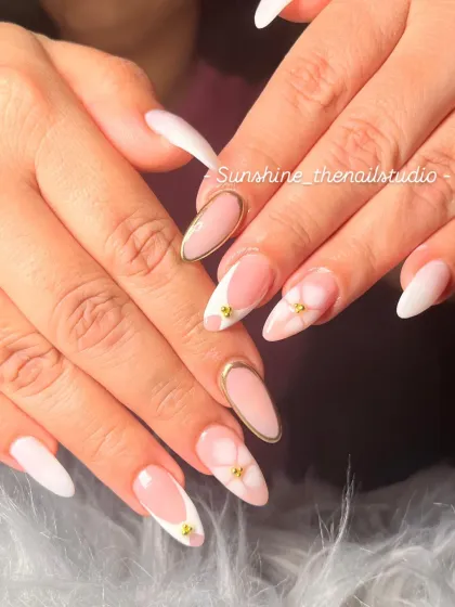 A full view of the elegant milky white set with gold chrome details.