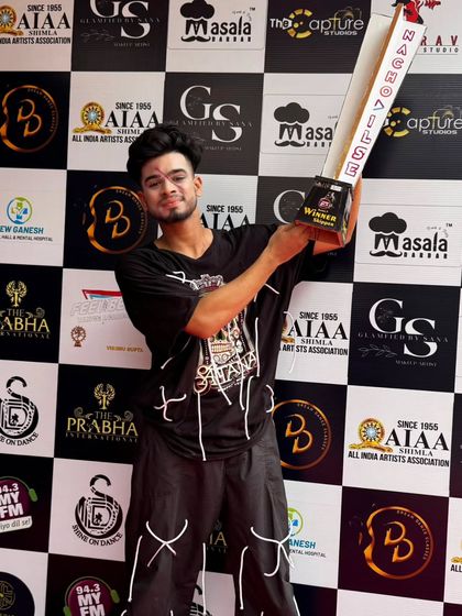 Another angle with the trophy. Every win is a team effort.