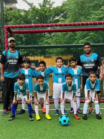 Our coaches with the Under-9 team, all set for the start of the Monsoon Super League.