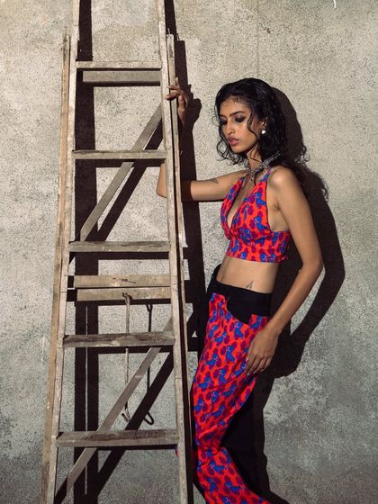 A softer, more pensive moment from the same series. The play of light and shadow adds depth to the portrait.