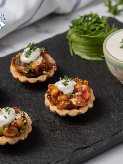 Another look at my mini Mexican tarts, topped with a dollop of sour cream and fresh parsley. These bite-sized treats are perfect for passing around at a cocktail party.