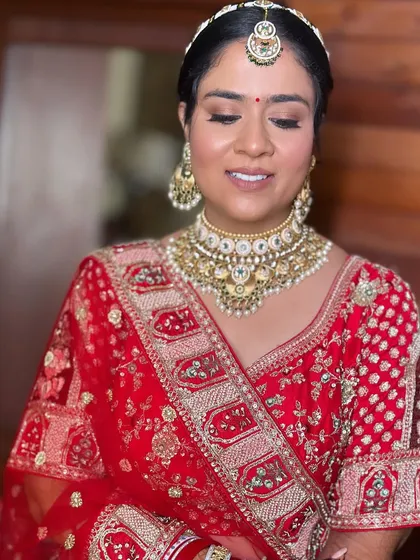 A close-up of Khushi's makeup. The soft shimmer on the lids and the perfectly blended base are key to this timeless bridal style.