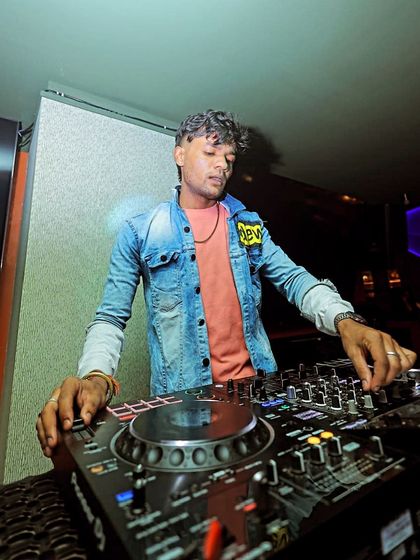 A close-up shot of me at the Pioneer DJ console, fully in control of the night's soundtrack.