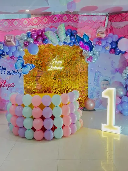 A wide shot of the butterfly-themed decor in a banquet hall.