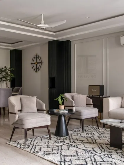 A wider view of the Scandinavian-inspired living and dining space. We manufactured the entire set of loose furniture, ensuring a consistent design language of clean lines and functional elegance throughout the open-plan area.