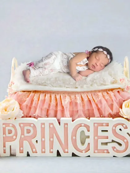 Another take on the newborn princess theme, showing the baby in a delicate lace outfit. These shoots are designed to be calm and comfortable for your little one.