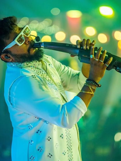 Our wind instrument specialist adding a layer of melodic soul to the performance. The versatility of our instruments is a key part of our appeal for private events.