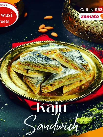 My Kaju Sandwich is a unique delicacy. It features a rich cashew and pistachio filling layered between thin sheets of kaju paste, creating a beautiful and delicious treat.