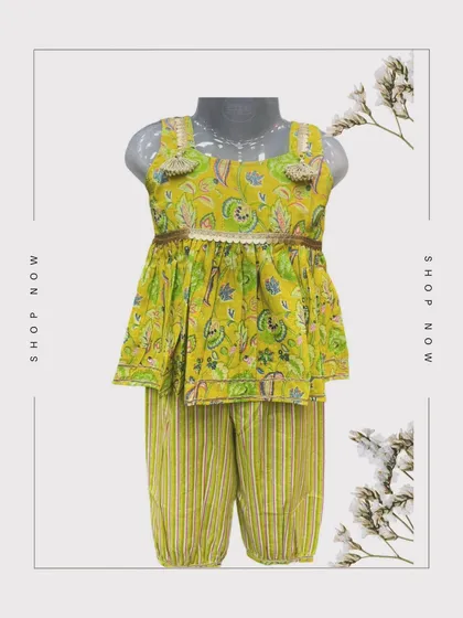 A radiant yellowish-green Indian outfit for your little fashionista. The charming floral top is adorned with playful tassels, and the striped bottoms have a comfy elastic waist.