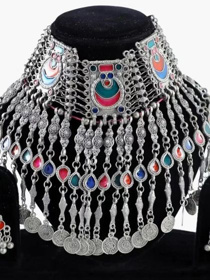 The same colorful oxidised set displayed on a bust, showing how the choker sits on the neckline.