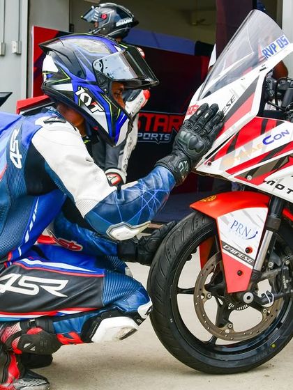 A rider's connection with their machine is crucial. Here, Rohith makes final checks before heading out, a testament to his focus and resilience after a tough race.
