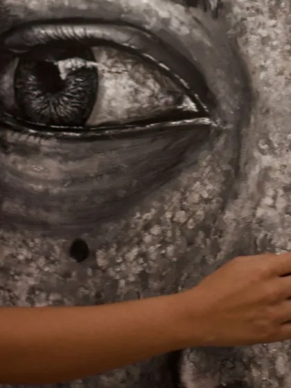The eyes are where the soul of a portrait lives. Here, I am carefully adding layers and reflections to bring life and emotion to the eye of 'The Tourist Guide.'