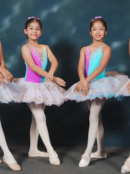 Our ballerinas in their vibrant costumes for 'Waltz of Hours.' These photos capture the poised and polished look of our young performers before they take the stage.