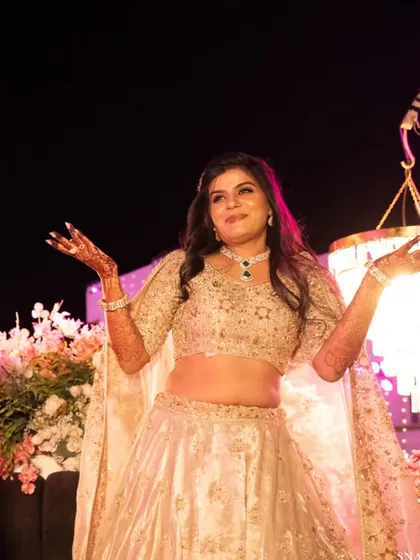 Another fun moment from the sangeet performance. The bride is glowing under the stage lights, looking every bit the star.