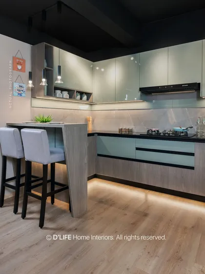 This compact kitchen with a breakfast bar showcases smart space utilization. The two-tone cabinets in grey and a soft mint green add a touch of modern color and style.