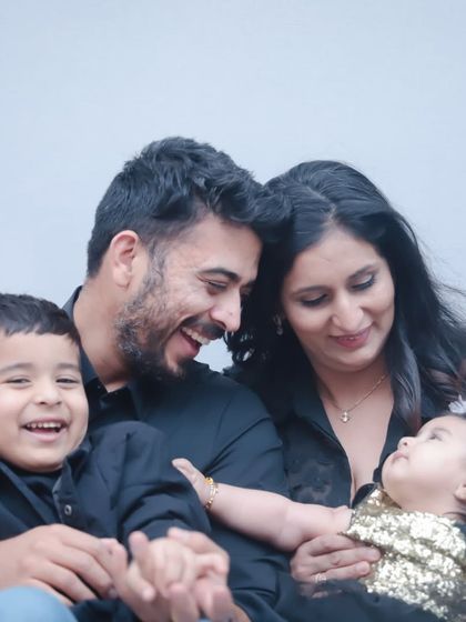The color version of the previous shot, showing the family's happy and loving interaction in the studio.