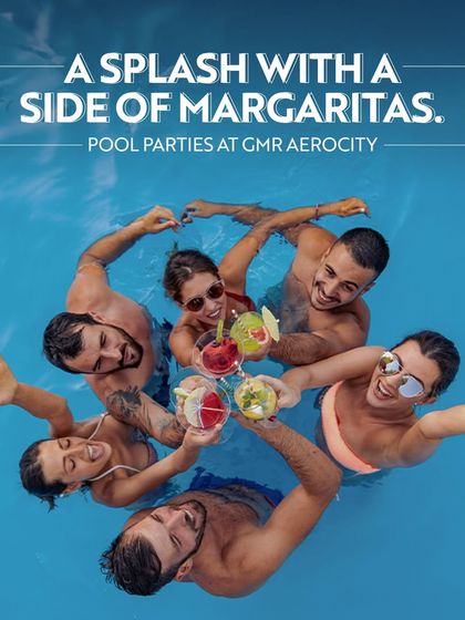 A fun-filled pool party scene with friends toasting with margaritas. This image captures the aspirational and recreational lifestyle we offer, perfect for a sunny day.
